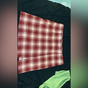 This is a stitch and pine skirt. It is a XL and is not stretchy.